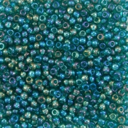 #083 10 Gramm Rocailles rainbow teal 9/0 2,6 mm