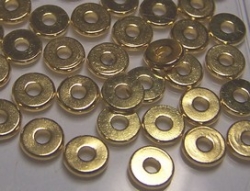 10 Stck. Metallscheiben - Ø ca. 6*1 mm - lt goldfarben