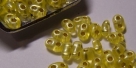 #06 10g Preciosa® TwinBeads yellow perl silver-lined
