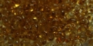 #81 10g Preciosa® TwinBeads tr. topaz/amber