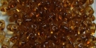 #82 10g Preciosa® TwinBeads tr. dark topaz/amber